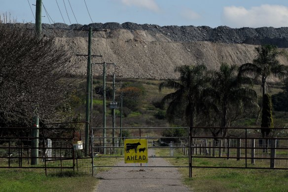 The Mount Pleasant mine, which will be extended, looms above a property in the Hunte Valley.